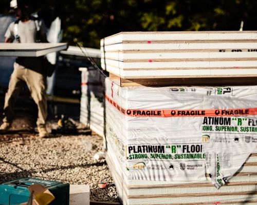 Platinum "R" Floor structural insulated flooring panels stacked on site ready for installation