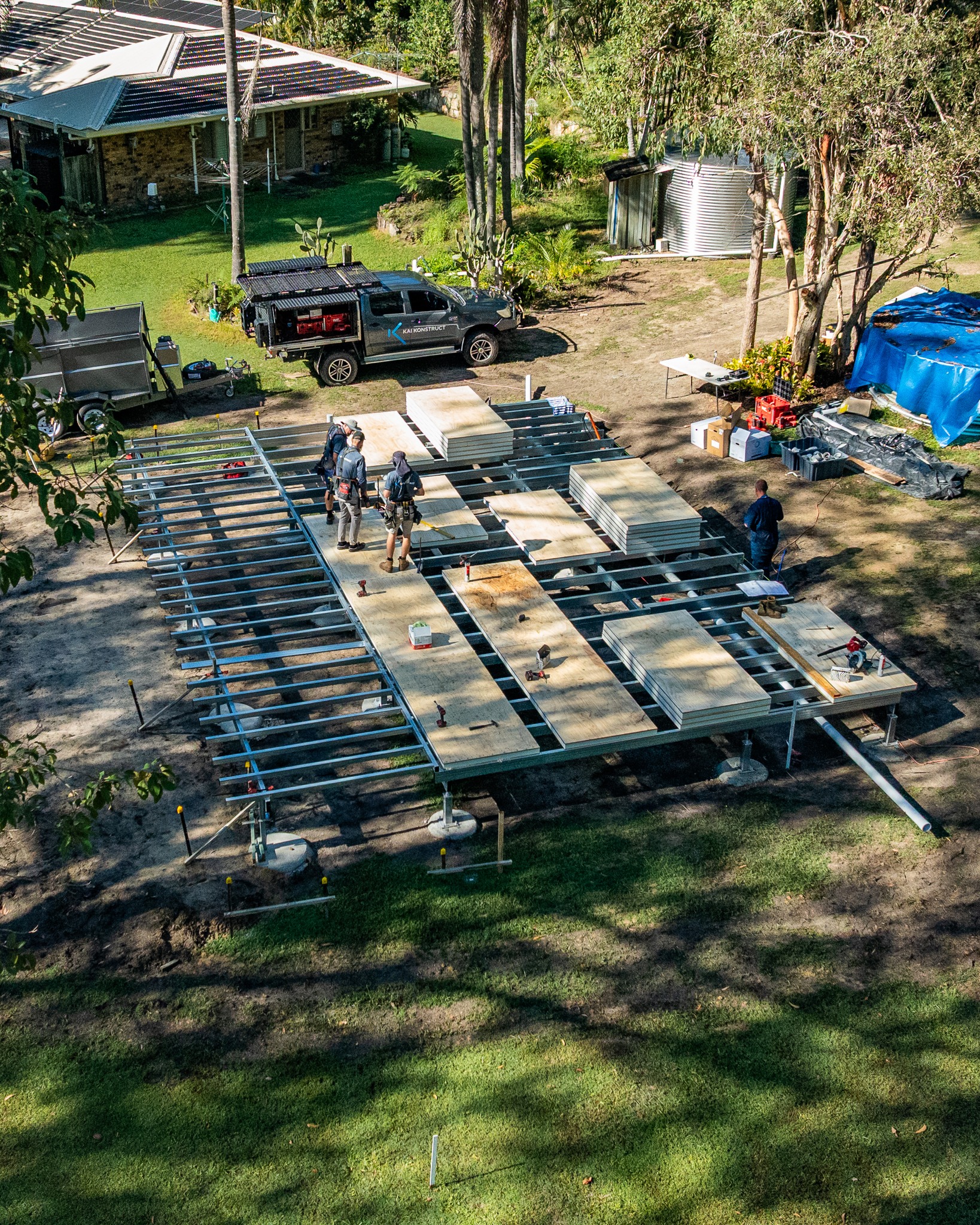 Suspended flooring system under construction, Platinum "R" Floor insulated panels laid over steel joists above a ventilated subfloor void