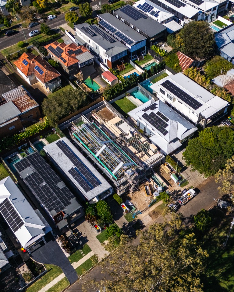 Aerial of a narrow-lot Brisbane home with its upper floor going down in Platinum "R" Floor